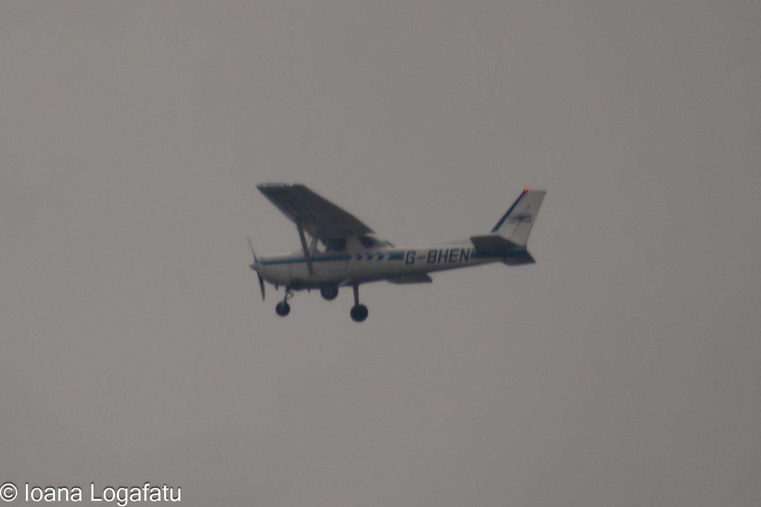 Plane gliding through dusk clouds